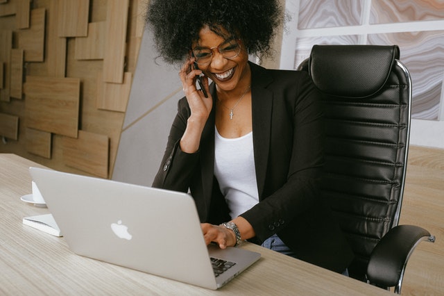 Woman on laptop happy