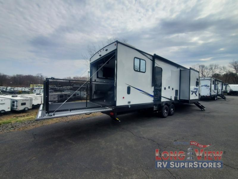Power ramp patio in the forest river vengeance rogue toy hauler travel trailer